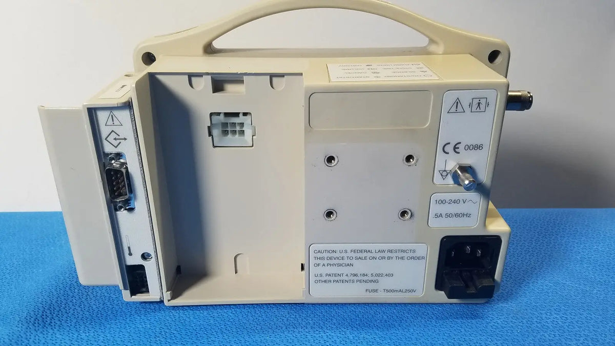 Beige casmed 740 masimo set spo2 blood pressure patient monitor back panel showing safety and electrical specifications