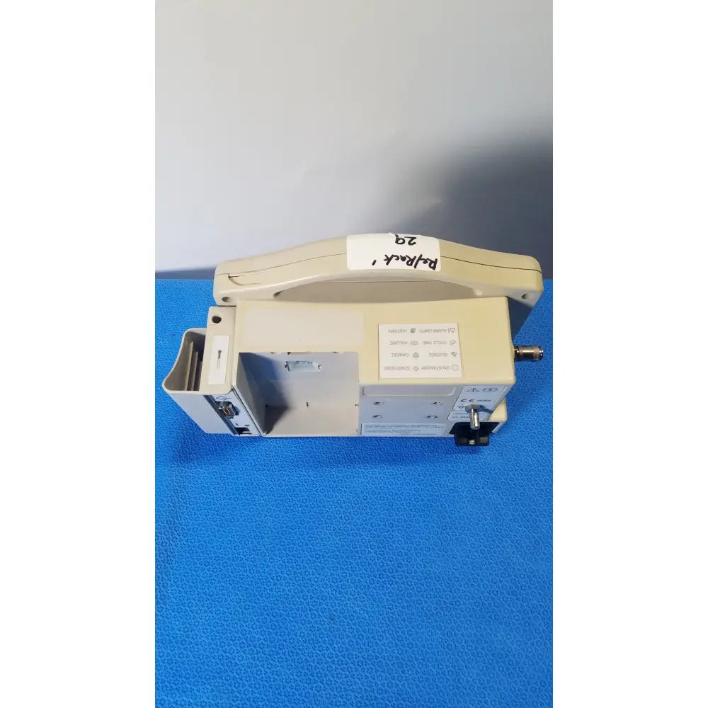 Beige casmed 740 masimo set spo2 blood pressure patient monitor with handle and control panel labeled pulmonar 29
