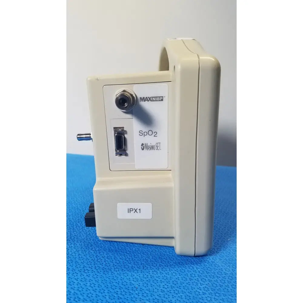 Beige casmed 740 masimo set spo2 blood pressure patient monitor back panel with circular port and rectangular connector