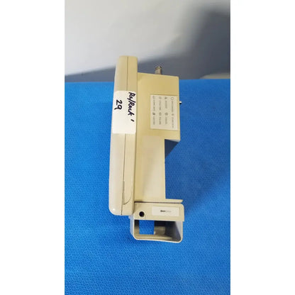 Beige plastic masimo set spo2 blood pressure patient monitor with labeled sections and small protruding connector view