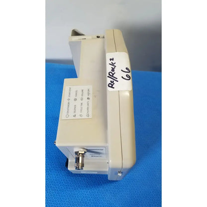 Beige plastic casmed 740 masimo set spo2 blood pressure patient monitor with labeled sticker and control buttons