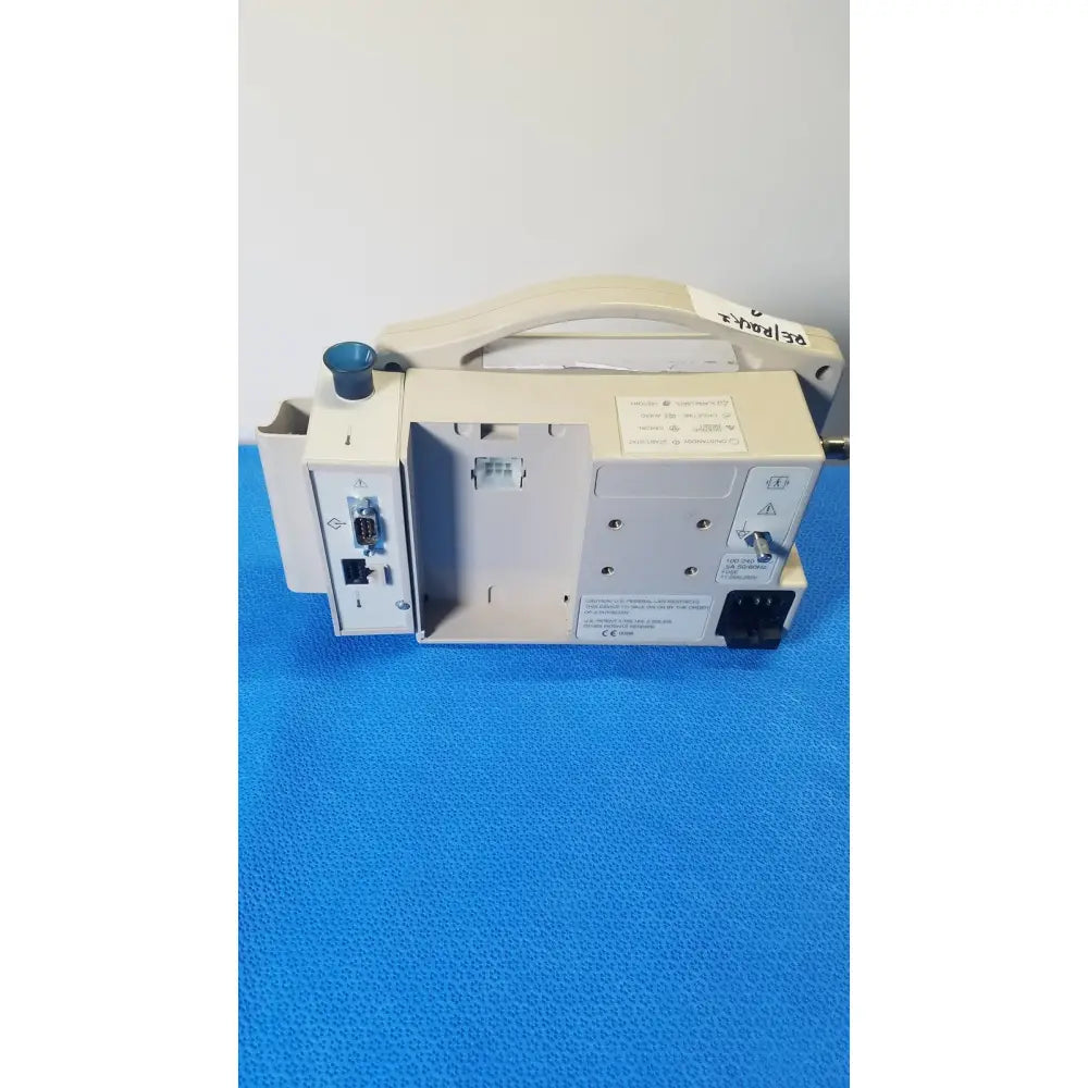 Beige casmed 740 max nibp vital signs monitor with handle and multiple ports on its side for medical use