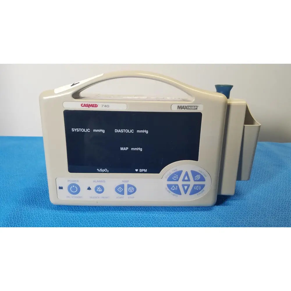 Beige casmed 740 max nibp vital signs monitor with digital blood pressure display and blue control buttons