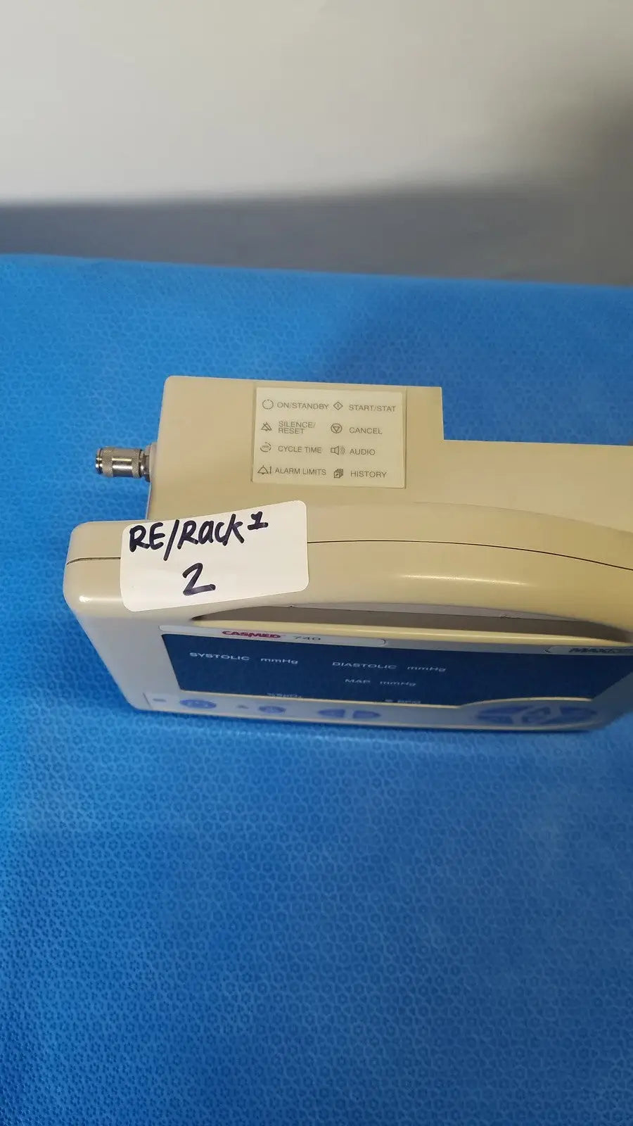 Beige casmed 740 max nibp vital signs monitor with blue display screen and control buttons for accurate monitoring