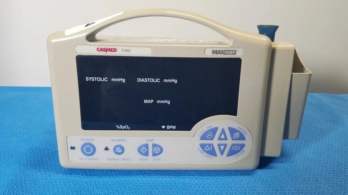 Beige casmed 740 max nibp vital signs monitor with digital blood pressure display and blue control buttons