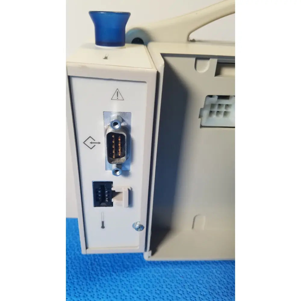 Beige casmed 740 patient monitor nibp with blue push-button and multiple ports including rs-232 for nibp spo2 masimo use