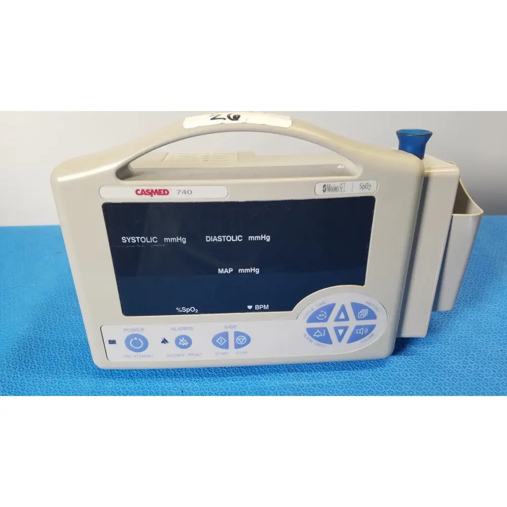 Beige casmed 740 patient monitor nibp spo2 masimo set with digital display and blue control buttons for vital signs monitoring