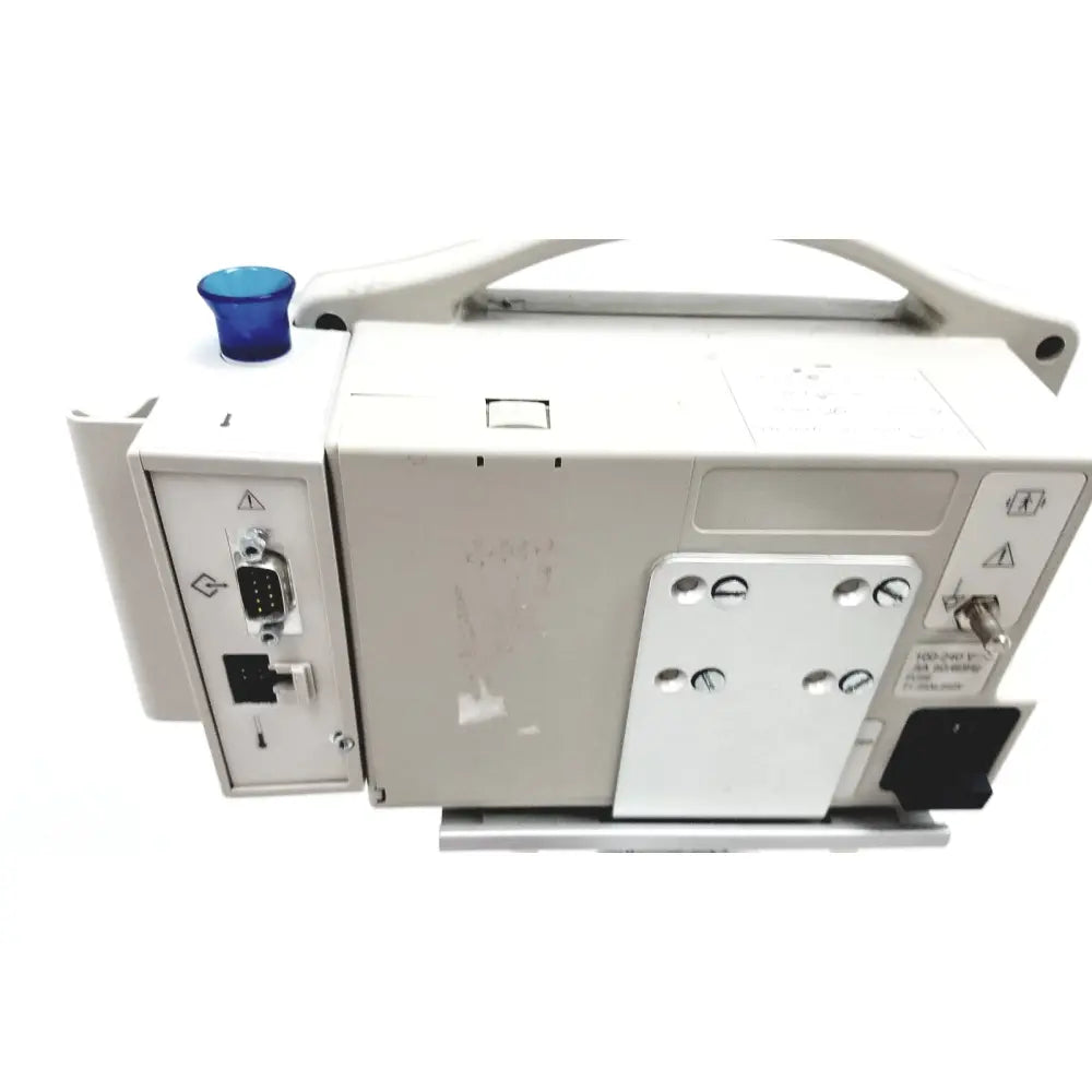 White patient monitor spo2 casmed 740 with blue button on top and multiple ports for medical use