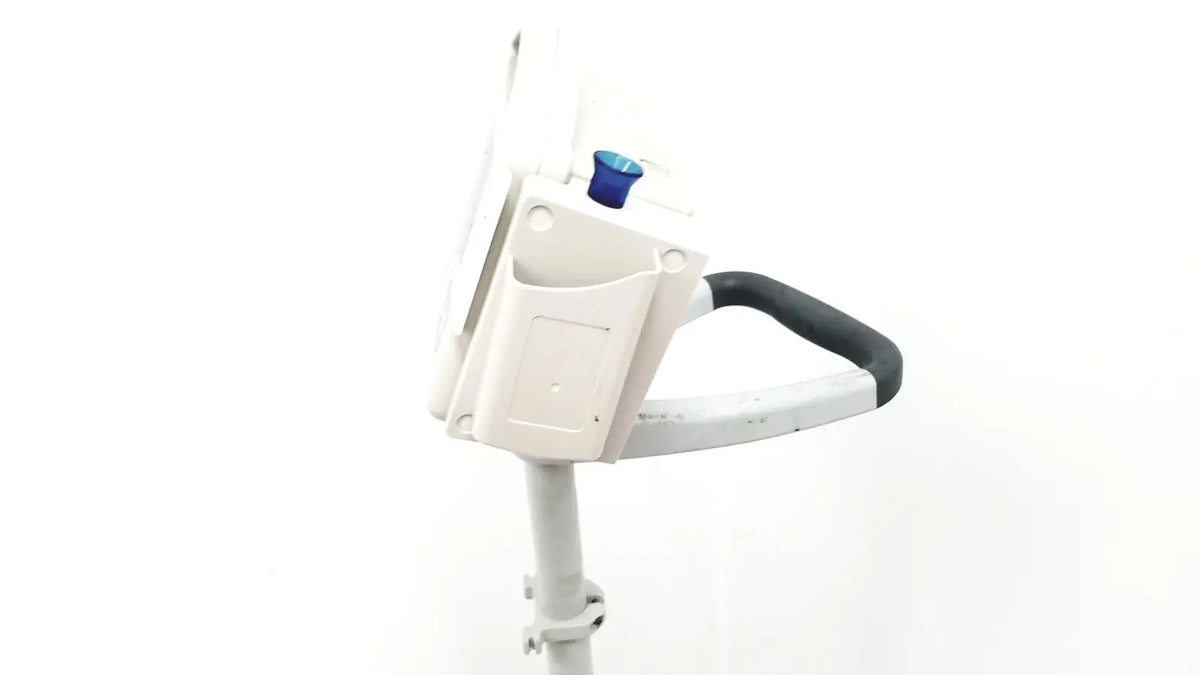 CasMed 740 patient monitor spo2 with rolling stand showing white plastic lawn edger with black handle and blue adjustment knob