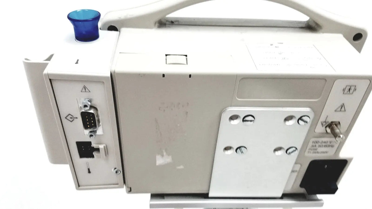 White patient monitor spo2 casmed 740 with blue button on top and multiple ports for medical use