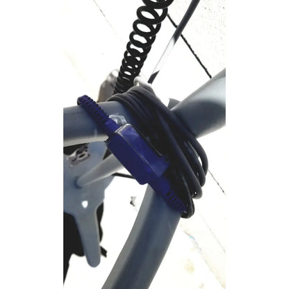 Blue braided cable tie securing a coiled black cord around a gray pipe on casmed 740 vital signs monitor sp02 finger probe