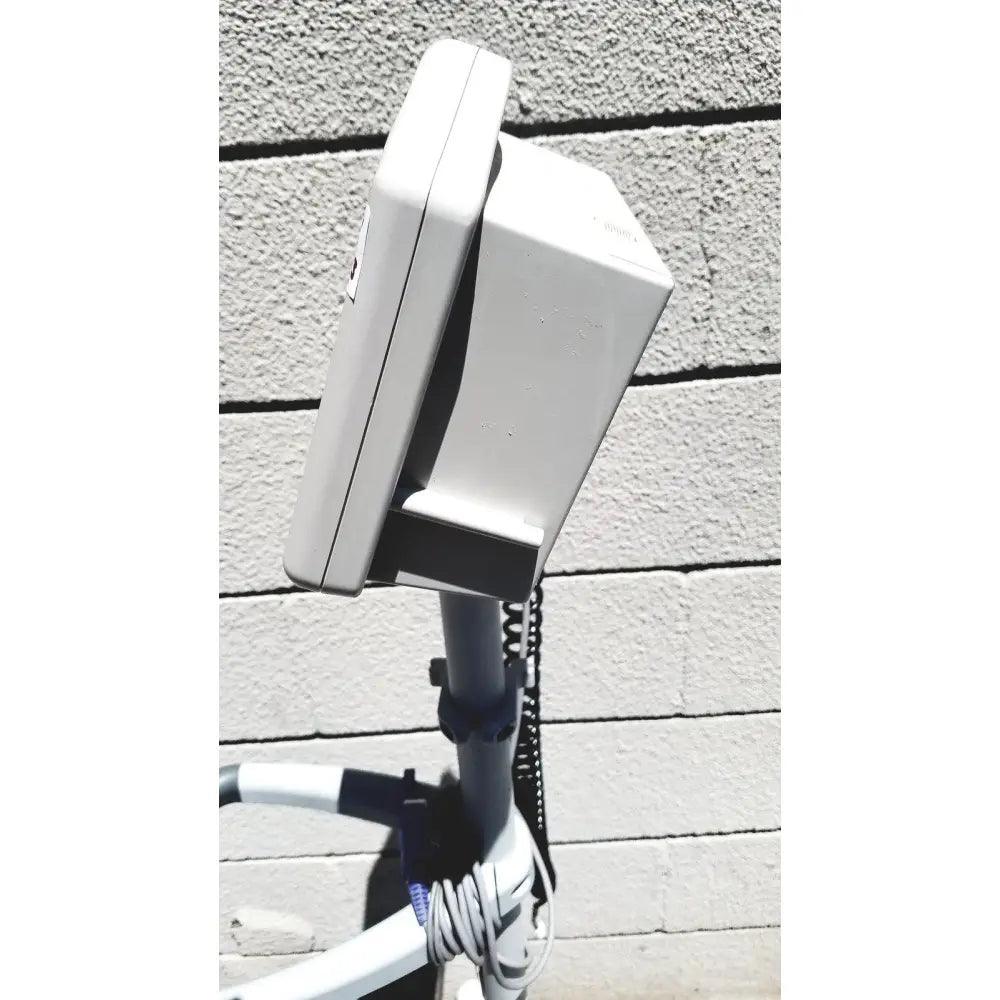 White rectangular outdoor electrical box with coiled cables supporting casmed 740 vital signs monitor sp02 finger probe