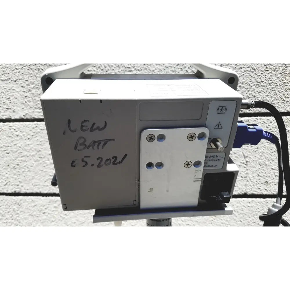 Gray casmed 740 vital signs monitor with blue power cable and new batt 5.2021 label featuring sp02 finger probe