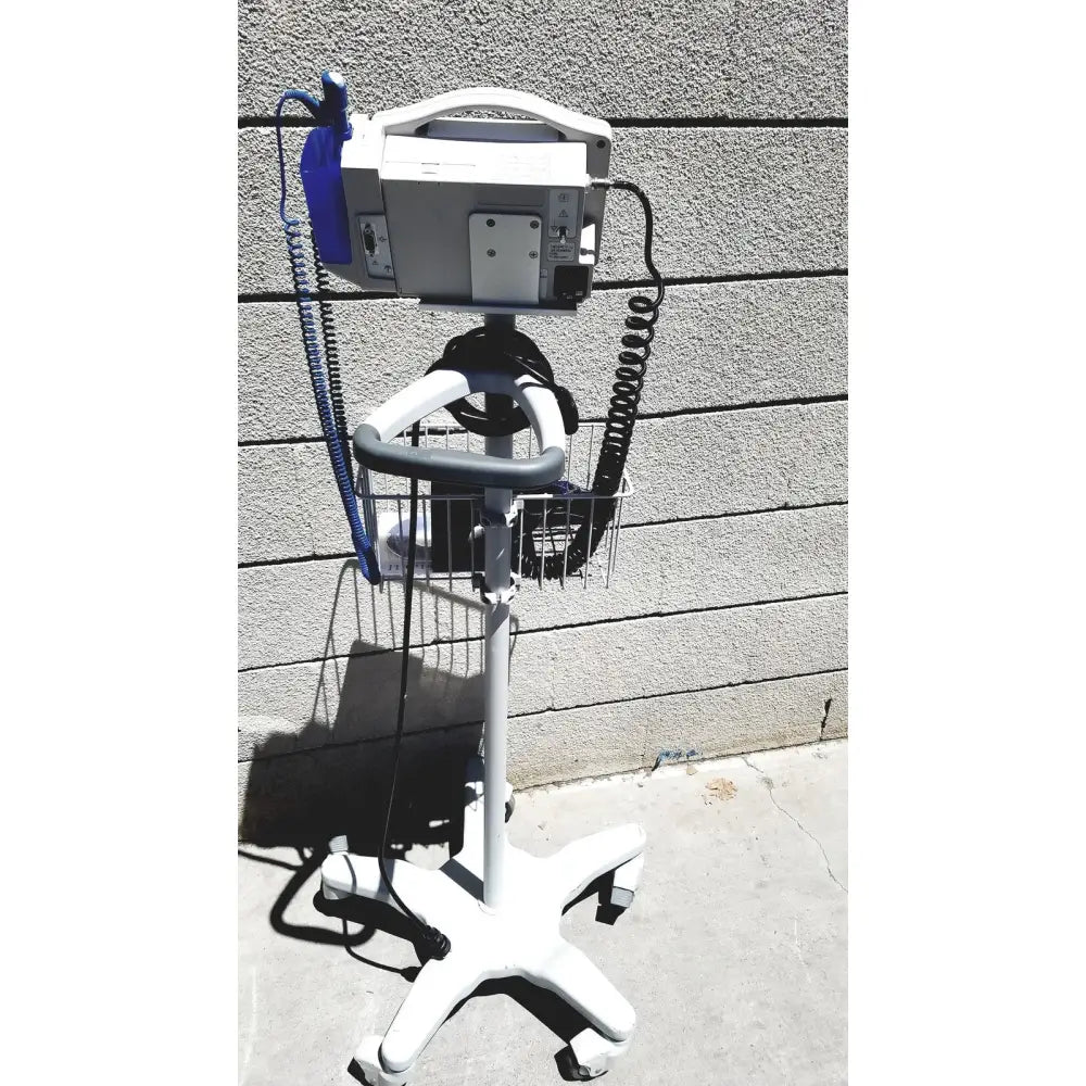 White casmed 740 vital signs monitor mounted on a wheeled cart with wire basket for medical use lot of 3
