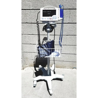 White casmed 740 vital signs monitor on wheeled stand with wire basket and blue tubing for medical use