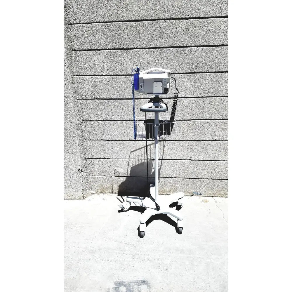 White medical iv infusion pump on wheeled metal basket cart in casmed 740 vital signs monitor rolling stand lot of 3