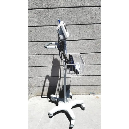 White medical cart with metal basket and wheels holding casmed 740 vital signs monitor for accurate vital signs monitoring
