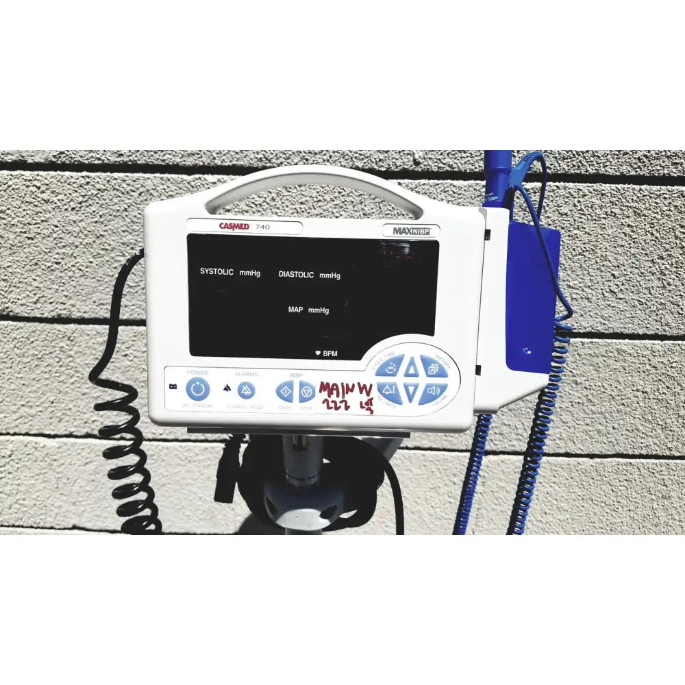 White casmed 740 maxxium vital signs monitor with black screen showing blood pressure and blue control buttons lot of 3