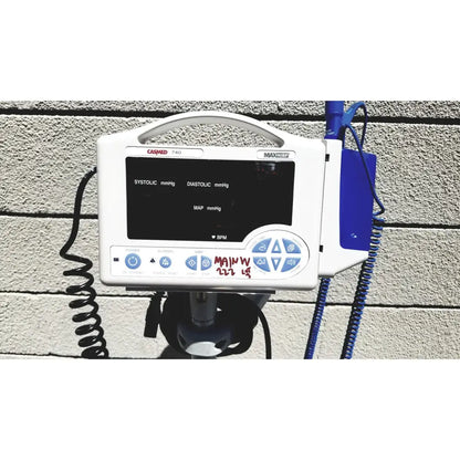White casmed 740 maxxium vital signs monitor with black screen showing blood pressure and blue control buttons lot of 3