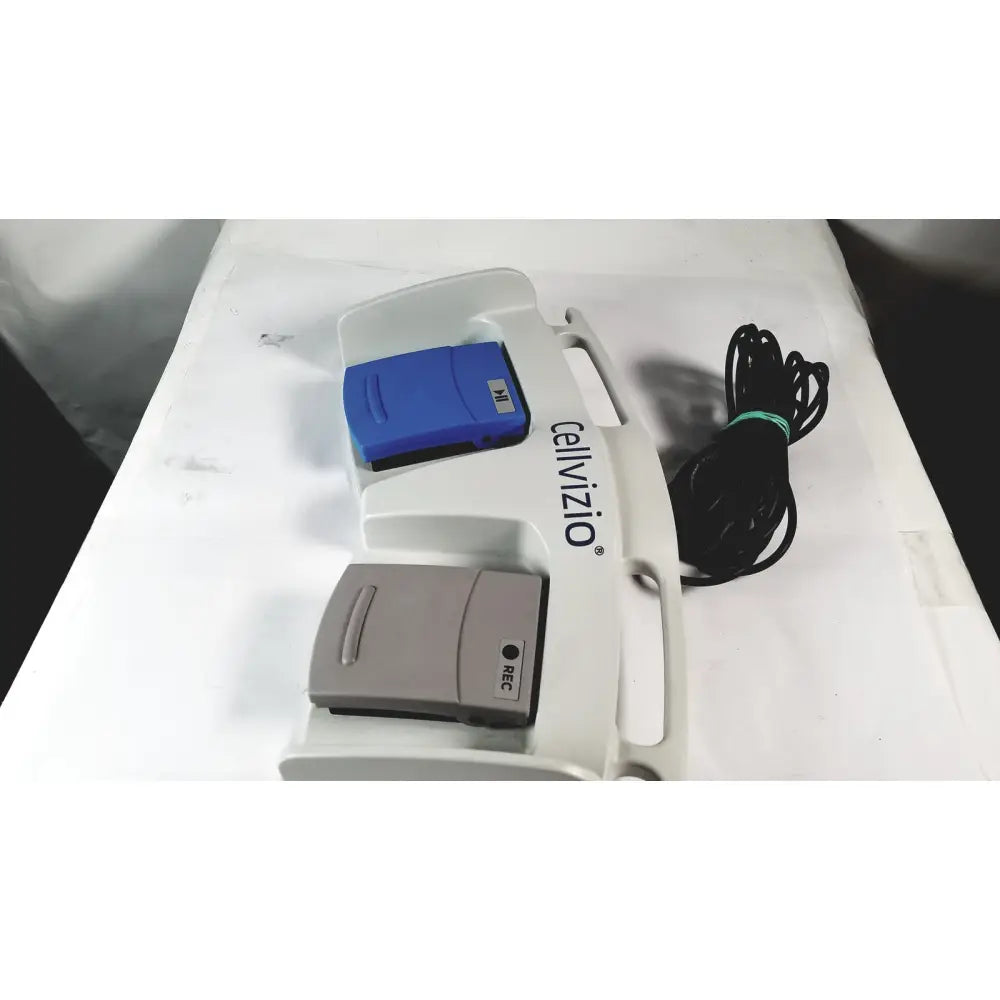 White Cellvizio foot pedal medical device with blue and gray components featuring rec label for reuse medical purposes