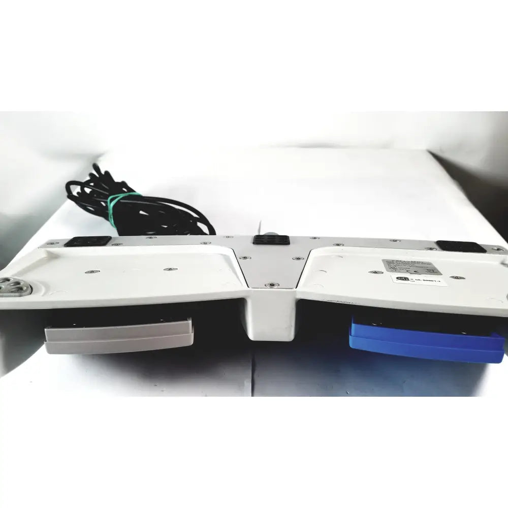 White and blue dual-slot cellvizio foot pedal with metallic accents for reuse medical imaging applications