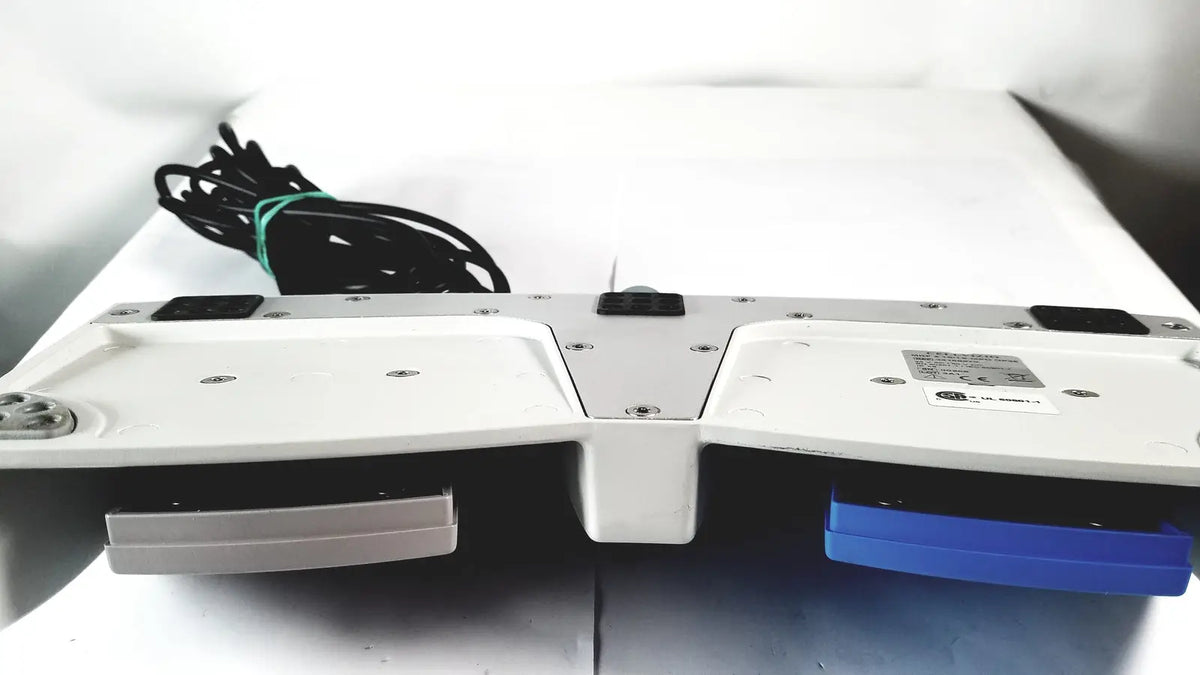 White and blue dual-slot cellvizio foot pedal with metallic accents for reuse medical imaging applications