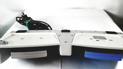 White and blue dual-slot cellvizio foot pedal with metallic accents for reuse medical imaging applications