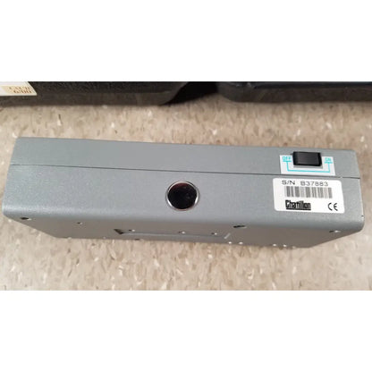 Gray metallic chaltilon csd200 dynamometer with black toggle switch and circular port on its back side