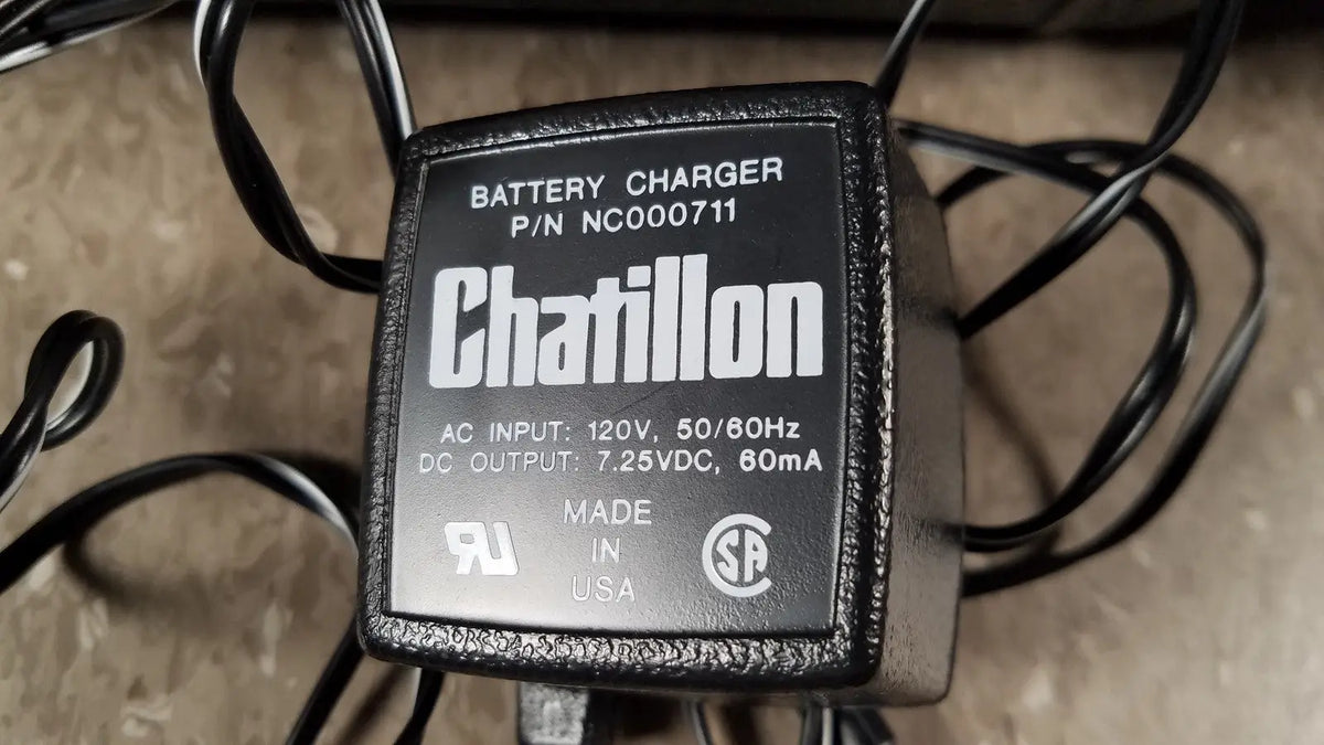 Black textured chaltilon csd200 dynamometer battery charger with labeled specifications for reuse medical use