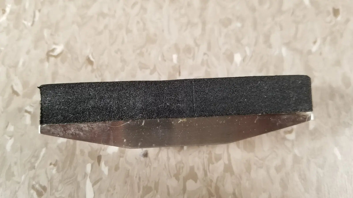 Black abrasive sanding block with metallic base for chaltilon csd200 dynamometer reuse medical applications