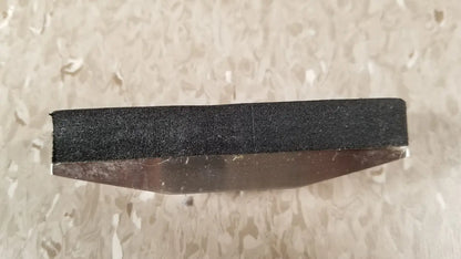 Black abrasive sanding block with metallic base for chaltilon csd200 dynamometer reuse medical applications