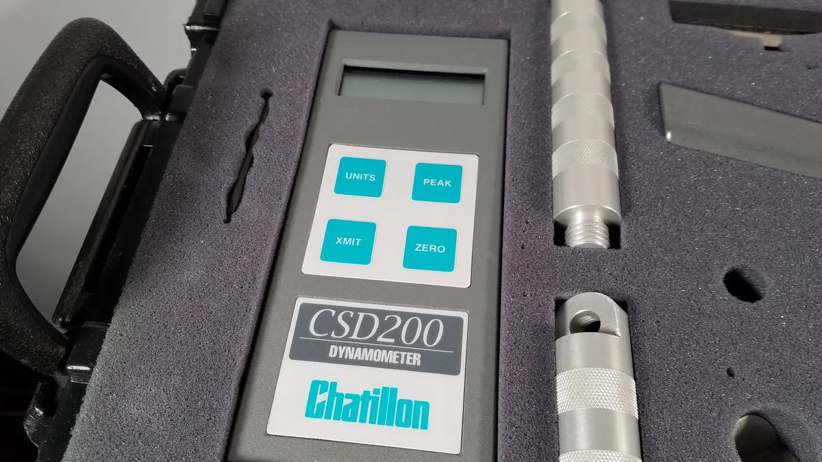 Gray chaltilon csd200 dynamometer with digital display and teal buttons in black case with metallic probes