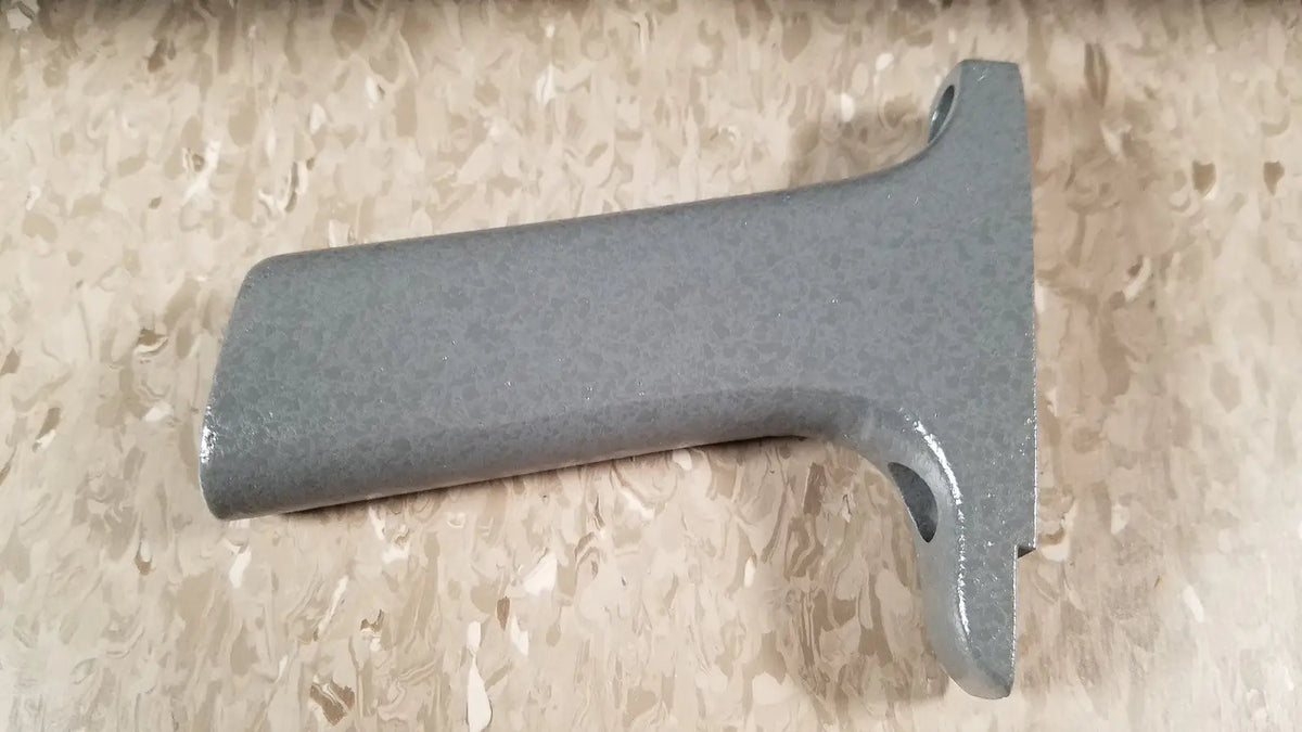 Gray metallic handle with textured matte finish and two circular cutouts on chaltilon csd200 dynamometer reuse medical device