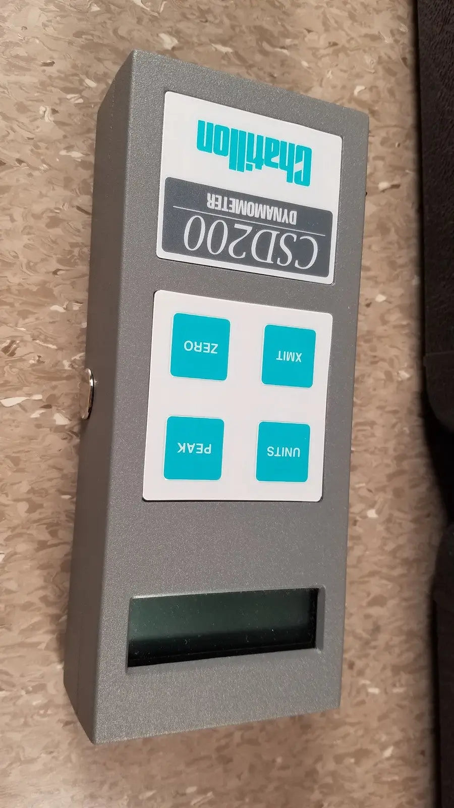 Gray chaltilon csd200 dynamometer featuring teal buttons and a digital display for precise force measurement