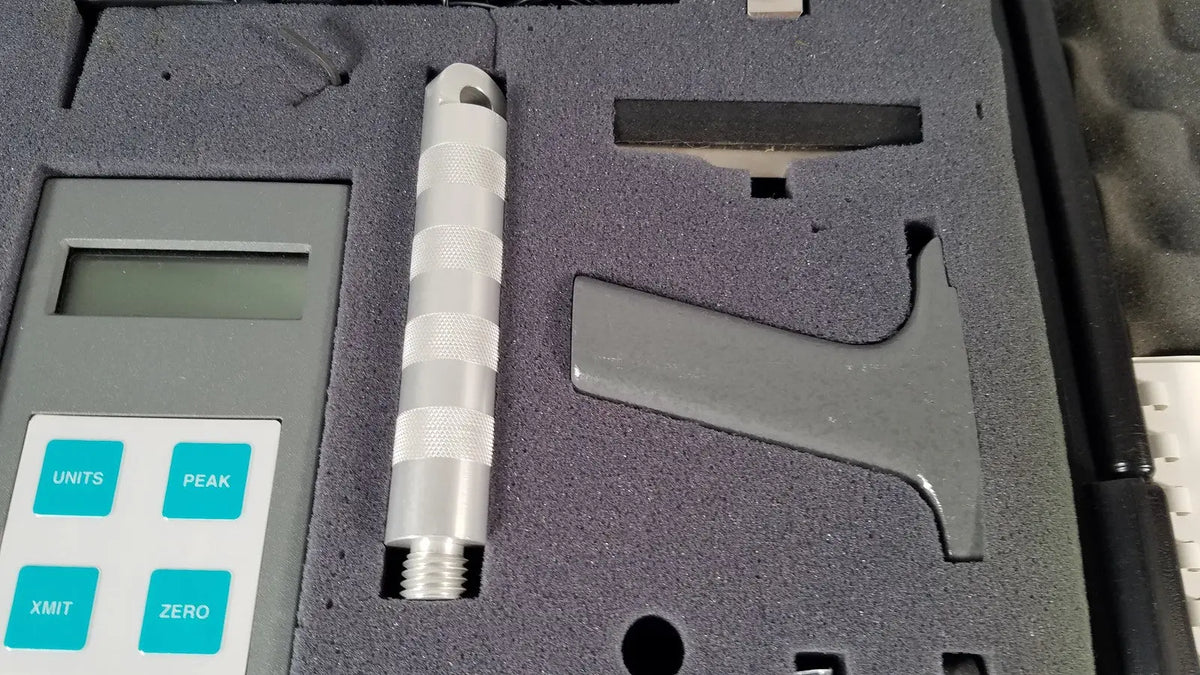 Silver metallic chaltilon csd200 dynamometer probe with textured grip and digital display in foam-lined reuse medical case