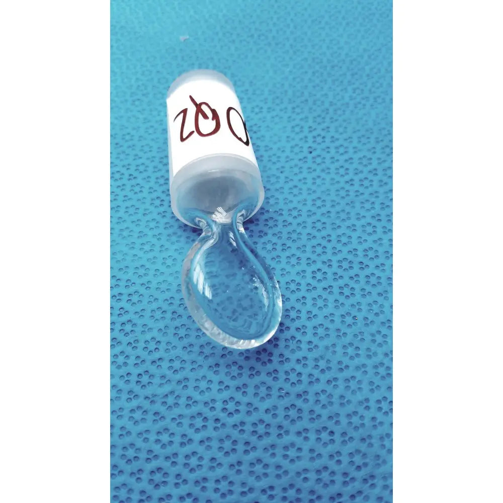 Clear glass chemglass high vacuum glass stopcock with white label marked 200 and teardrop-shaped dropper attached