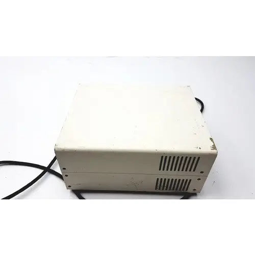 Beige plastic power supply unit with ventilation slits and black cables by chiu technical corporation mercury 100w model m-100t