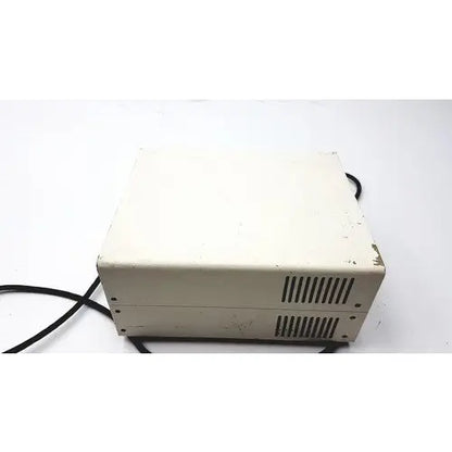 Beige plastic power supply unit with ventilation slits and black cables by chiu technical corporation mercury 100w model m-100t