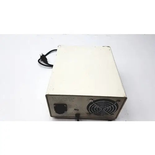 Off-white rectangular chiu technical corporation mercury 100w model m-100t power supply unit back with black cord and ventilation grille