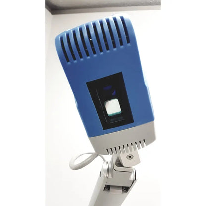 Blue and gray handheld scanner with rectangular lens housing for Christie VeinViewer Vision vein visualization system with stand