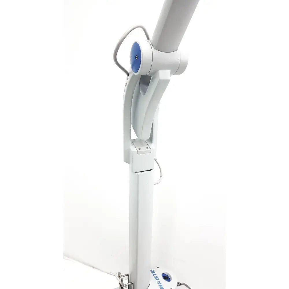 White medical examination lamp with blue control knob and adjustable arm in christie veinviewer vision vein visualization system