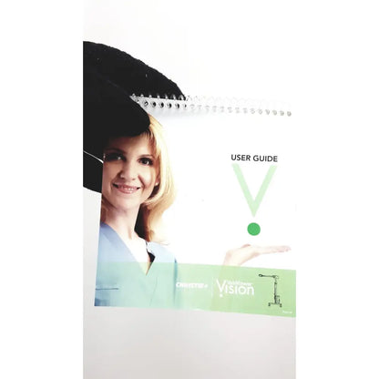 White spiral-bound user guide with green accent band for christie veinviewer vision vein visualization system with smiling nurse