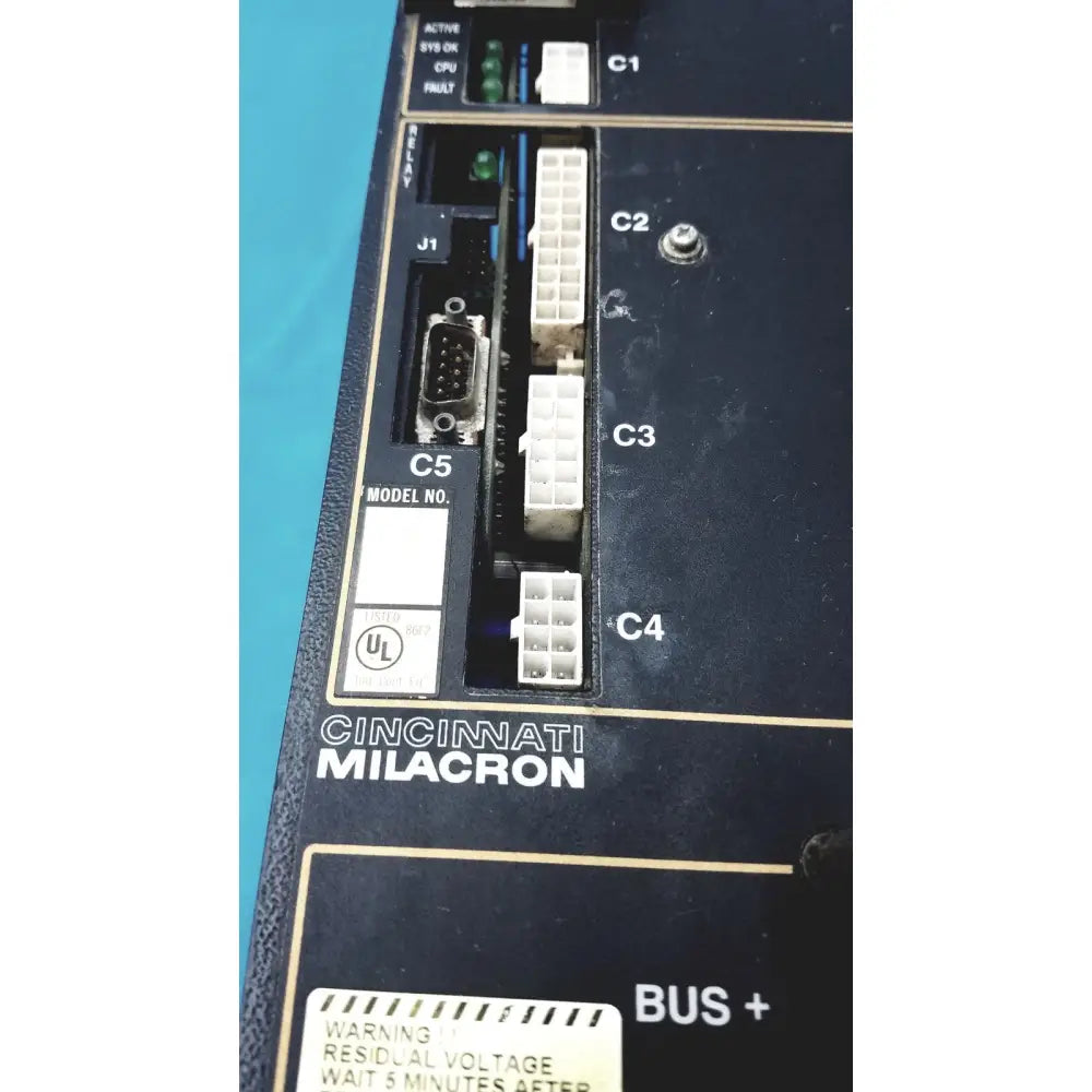 Black Cincinnati Milacron C5 spindle drive control panel with white connectors and green indicator lights for industrial use