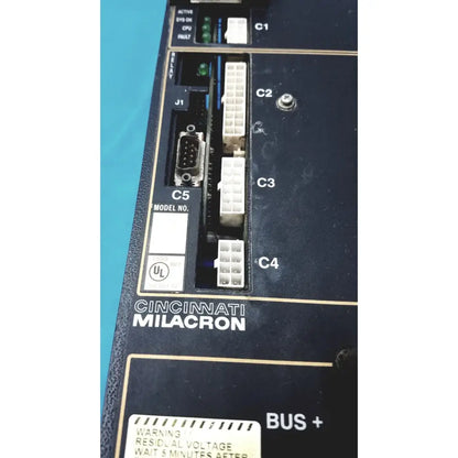 Black Cincinnati Milacron C5 spindle drive control panel with white connectors and green indicator lights for industrial use