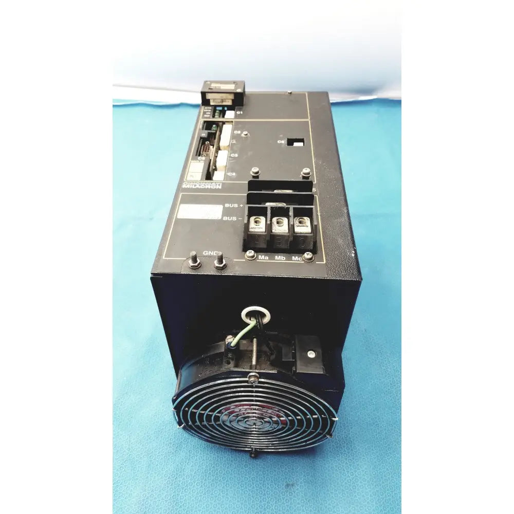 Black industrial power supply unit with front fan grille and labeled controls for Cincinnati Milacron C5 spindle drive