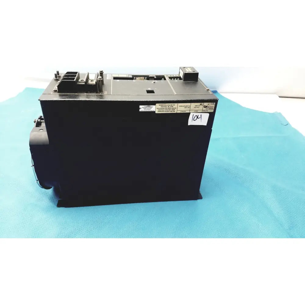 Black rectangular cincinnati milacron c5 spindle drive with metallic components and labeled stickers on top surface