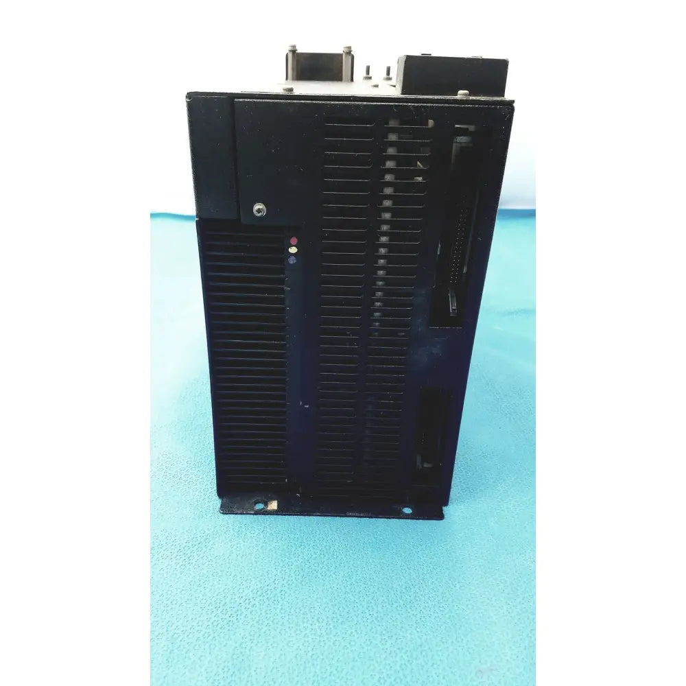 Black industrial motor controller with ribbed heat sink and mounting brackets for cincinnati milacron c5 spindle drive