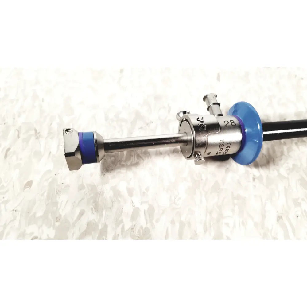Silver surgical endoscope with blue plastic components and engraved markings in circon acmi sheath esrs-28 with etor-28 obturator