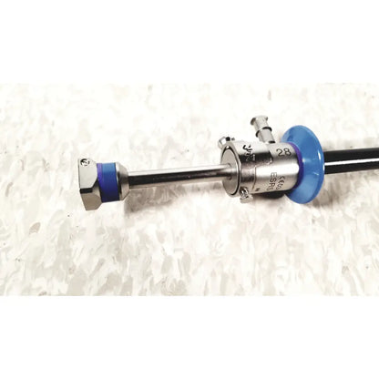 Silver surgical endoscope with blue plastic components and engraved markings in circon acmi sheath esrs-28 with etor-28 obturator