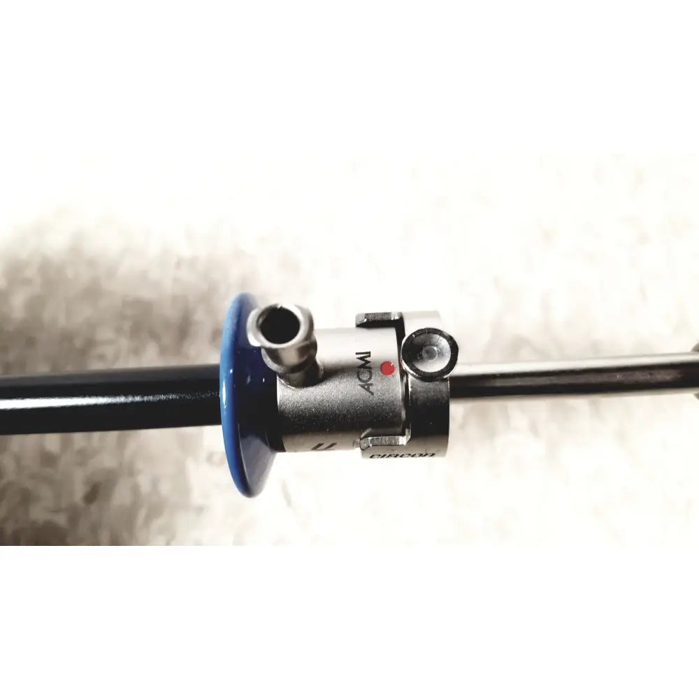 Silver and blue circon acmi sheath endoscope with metallic body, black shaft, and branded markings for surgical use